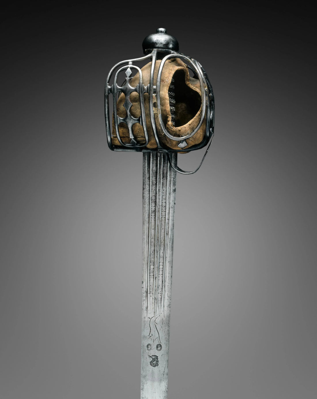 Historical Scottish broadsword with basket hilt, broad double-edged blade, and traditional European sword design