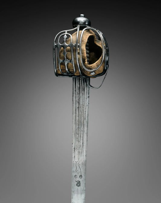 Historical Scottish broadsword with basket hilt, broad double-edged blade, and traditional European sword design